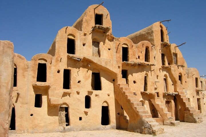 Traditional architecture of the Douiret ksar, with stacked granaries and earthen walls.