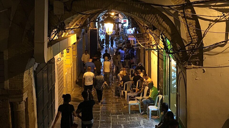 Old Medina of Tunis after iftar during Ramadan, showing streets, lanterns, and local evening life