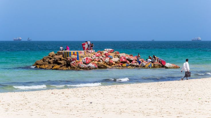 Bou Jaafar Beach in Sousse with a sandy shoreline, Mediterranean Sea and the city's lively seaside promenade