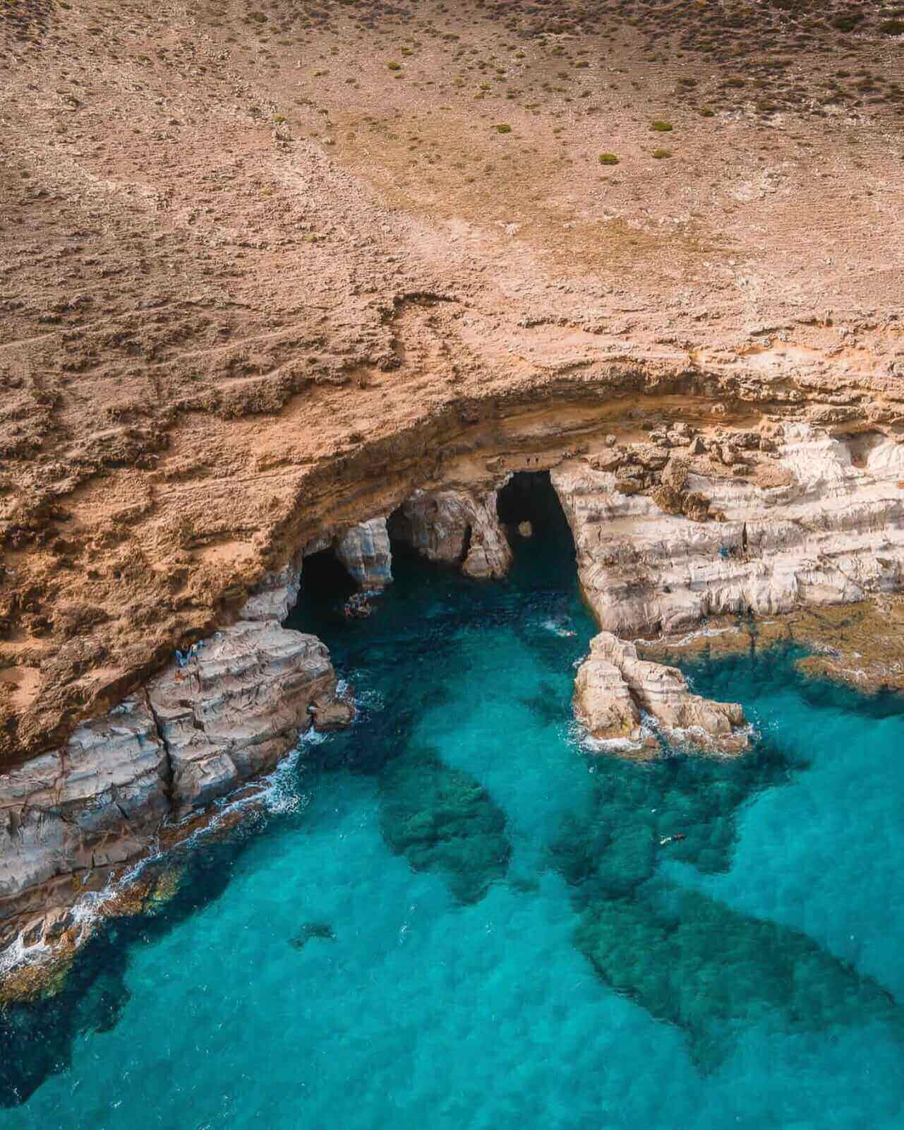 Cap Zebib Beach in Bizerte with crystal-clear Mediterranean waters, rocky coastline, sandy coves and natural rock pools