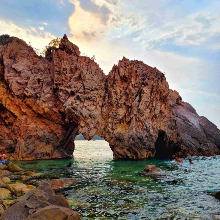 Melloula Beach near Tabarka with golden sand, turquoise Mediterranean waters, rocky coastline and surrounding pine forests