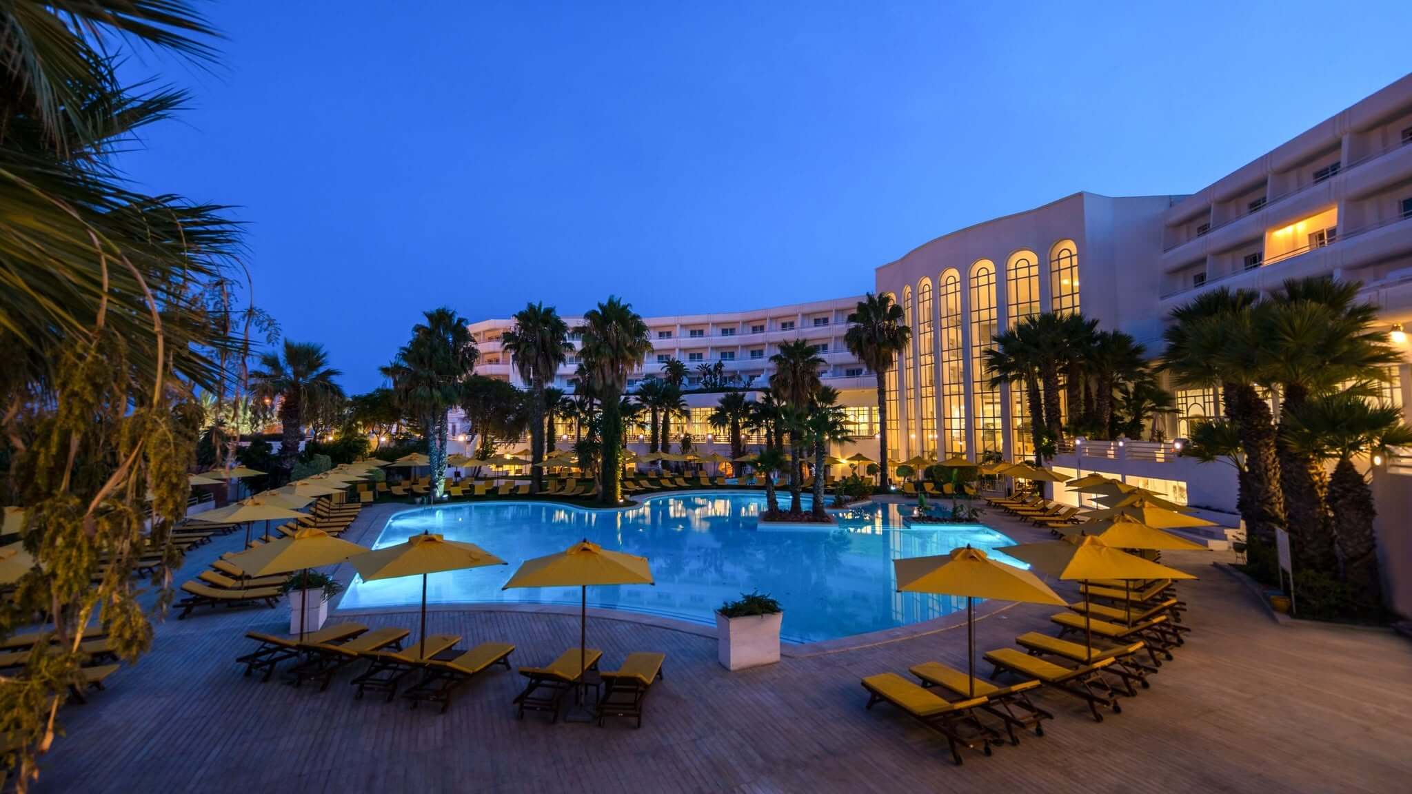 Laico Hammamet hotel with swimming pool and palm trees in Tunisia